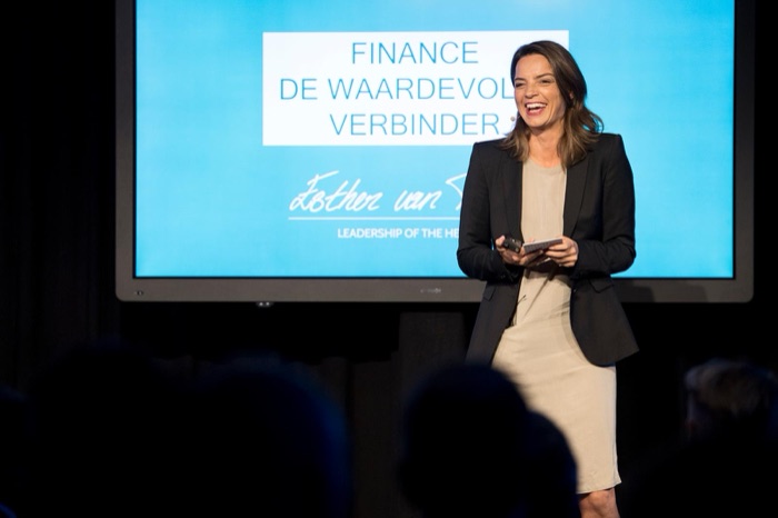 Esther van Toledo speaking at a finance conference